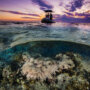 Boat floating above reef in Australia